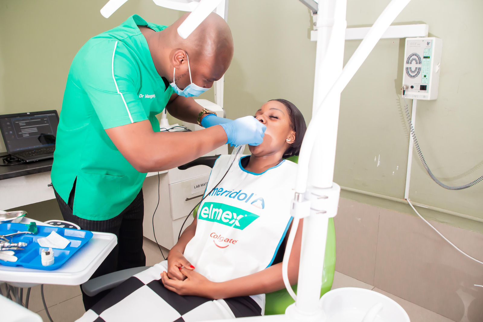 Smiling dentist with patient